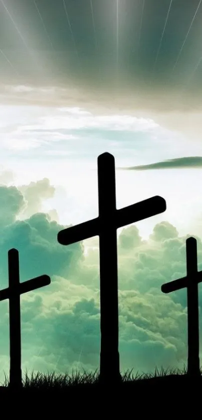 Three crosses silhouetted against a cloudy sky with beams of light.