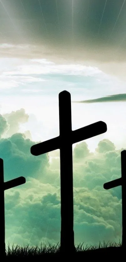 Three crosses silhouette with clouds backdrop, conveying peace and spirituality.