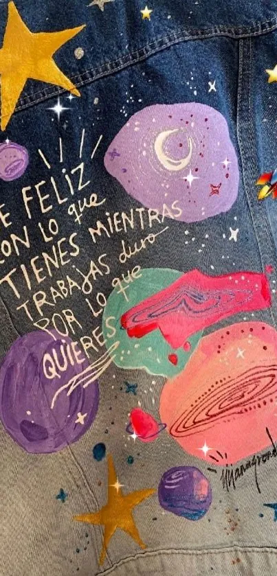 Denim jacket with colorful planets and a motivational quote.