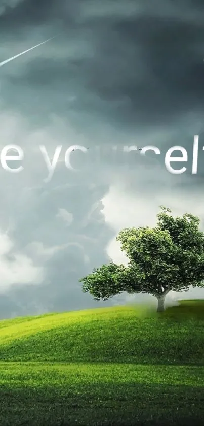 Inspirational wallpaper with green hill and tree saying 'Be yourself' under cloudy sky.