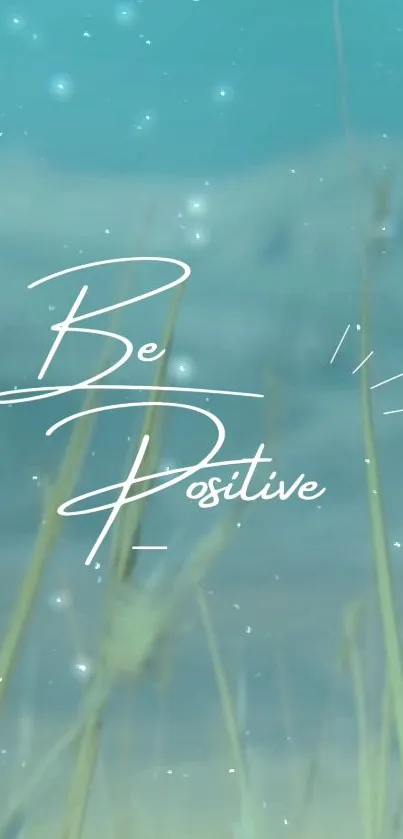 Be Positive text over a beautiful nature background with blue sky.