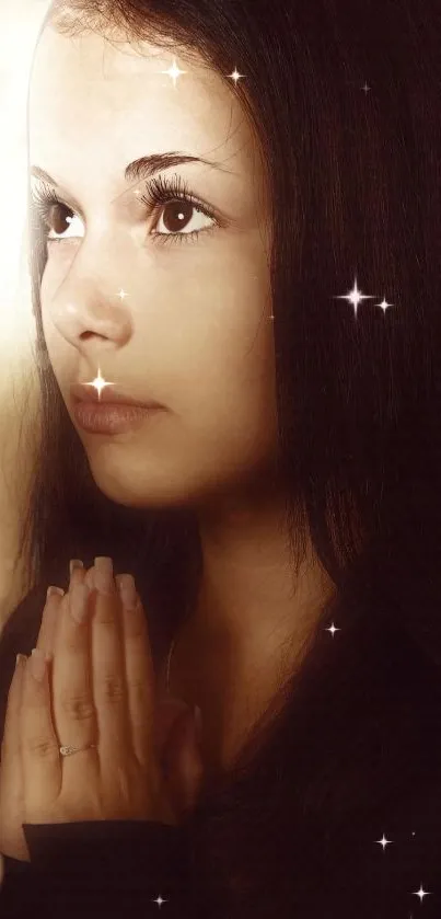 Woman praying with stars and warm glow on mobile wallpaper.