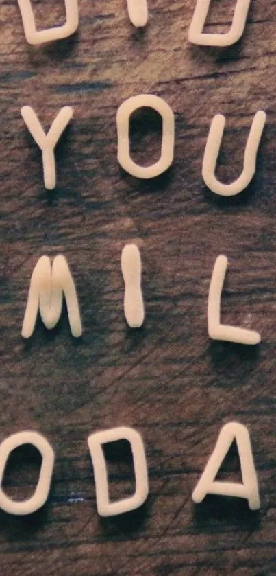 Pasta letters spelling 'Did You Smile Today' on a dark brown background.