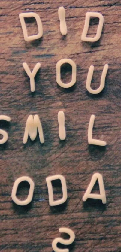 Inspiring mobile wallpaper with 'Did You Smile Today?' text on wood.