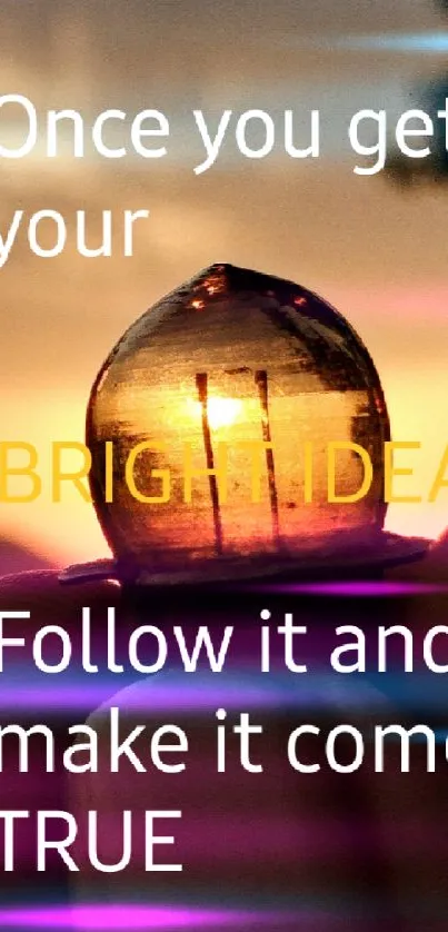 Motivational lightbulb against a sunset with inspiring quote.