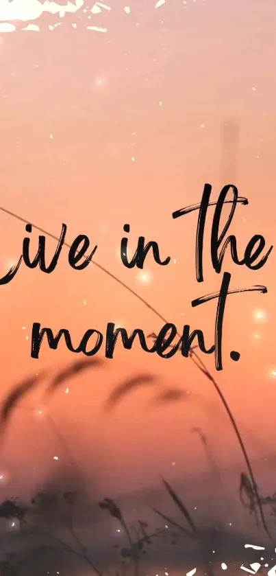 Live in the moment quote on a sunset background mobile wallpaper.