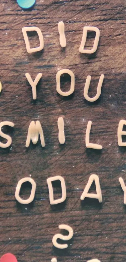 Inspirational message on wooden background with colorful confetti accents.