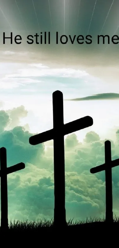 Wallpaper with crosses silhouetted against a serene, cloudy sky.