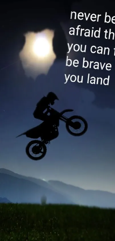 Silhouette of motorcycle rider with inspiring quote under a moonlit sky.