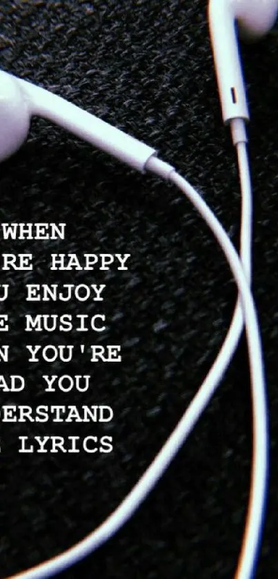 Inspiring music quote with earphones on dark background.