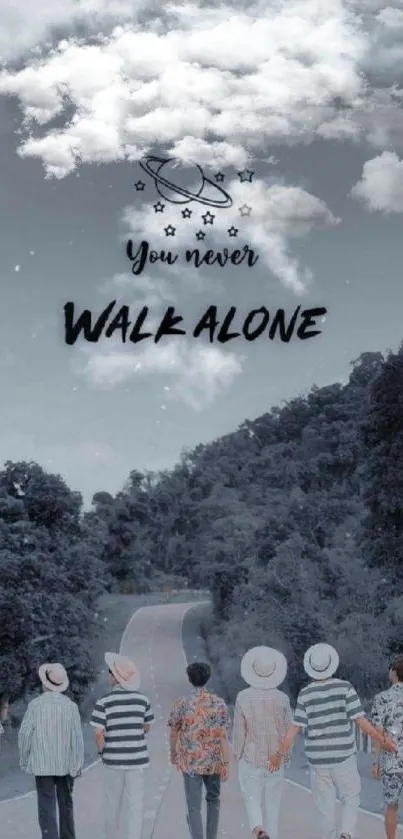 Inspiring scenic wallpaper with 'You Never Walk Alone' text and nature view.