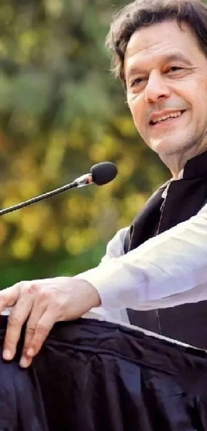 Man delivering a motivational speech at an outdoor event.