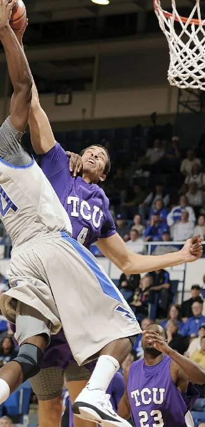 Basketball players in action with a powerful dunk, capturing the energy of the game.