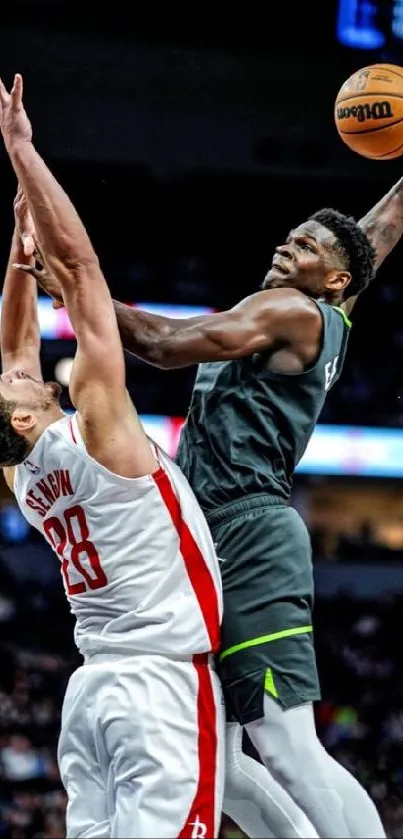 Basketball player performing a powerful dunk in a game setting.