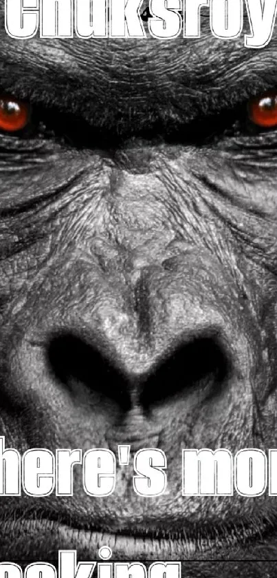 Close-up of intense gorilla with fiery eyes and dark textured skin.