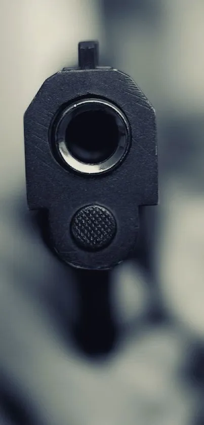 Monochrome close-up of gun barrel on wallpaper for mobile device.