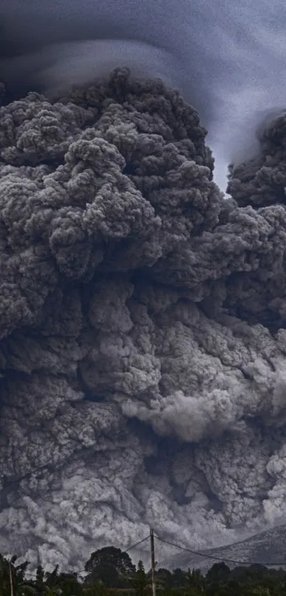 Towering ash clouds from a volcanic eruption with a gray sky.