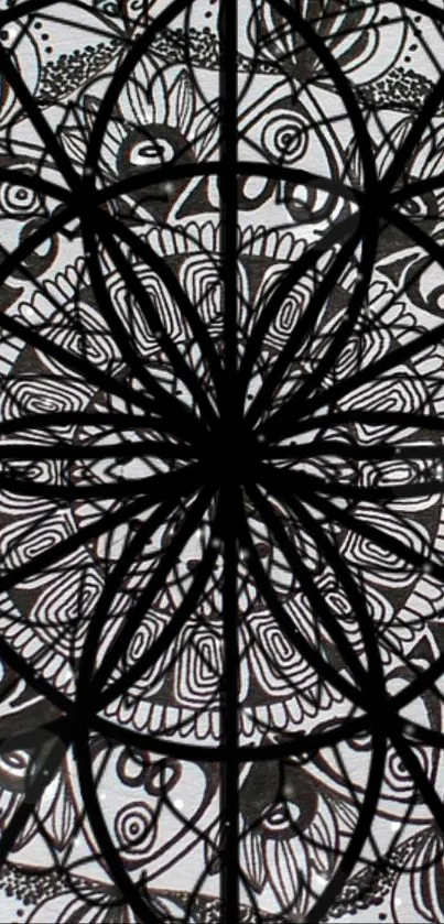 Black and white mandala with intricate geometric and floral patterns.