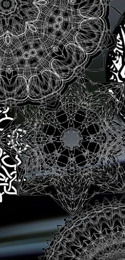 Intricate black and white geometrical mandala design wallpaper.