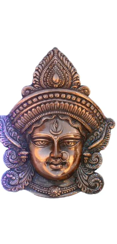 Intricate bronze sculpture on white background.