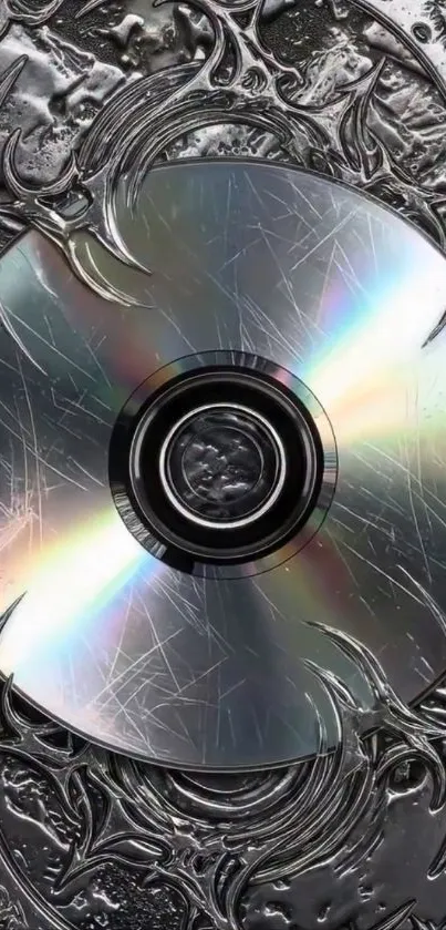 A metallic CD design with intricate patterns on this mobile wallpaper.
