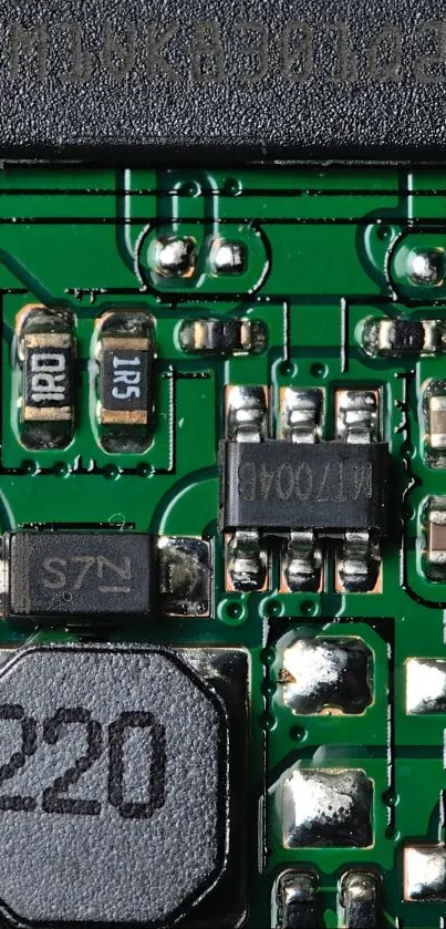 Detailed view of a mobile phone circuit board with green pathways.