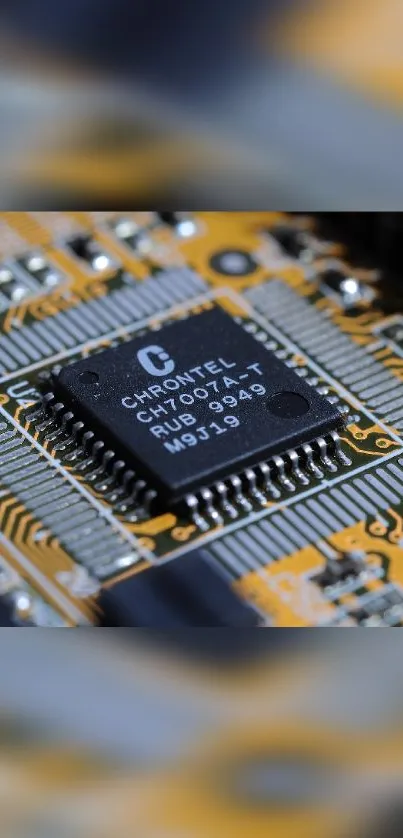 Close-up of a detailed circuit board highlighting a microchip with vivid orange design.