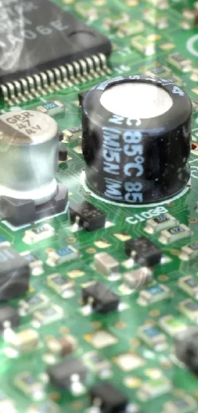 Close-up view of a green circuit board with electronic components.