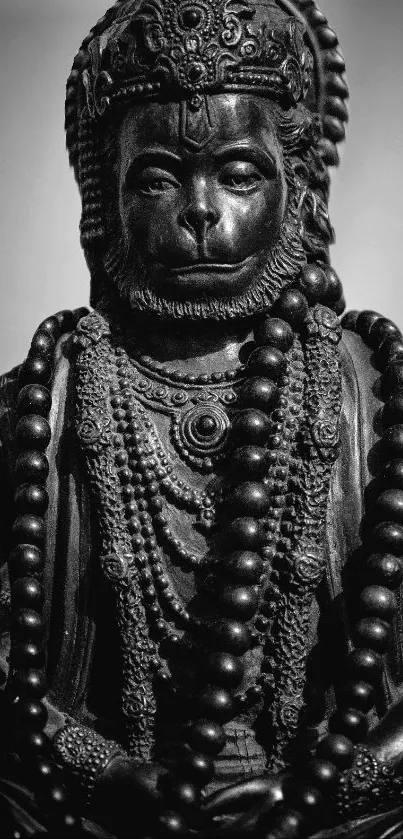 Black and white Hanuman statue with intricate detailing.