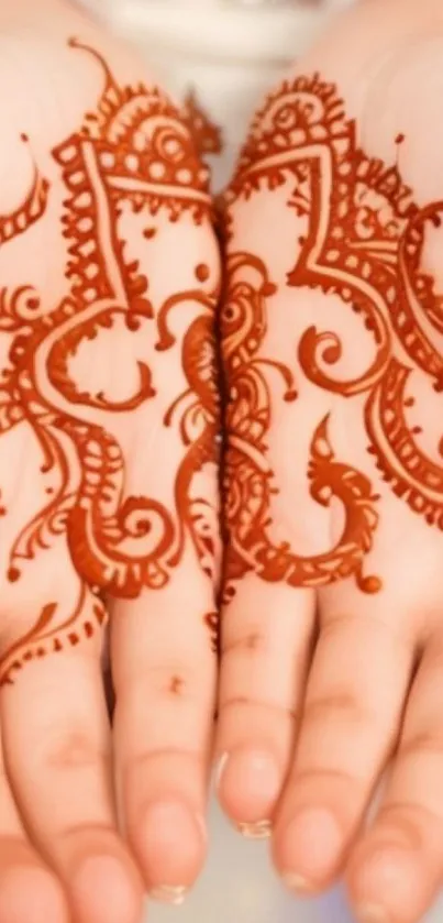 Intricate henna art design on feet with rich brown hues.