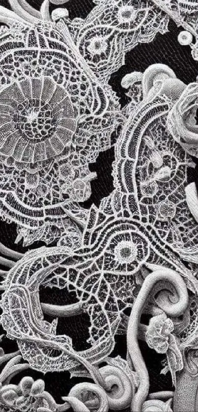 Intricate lace pattern wallpaper with detailed embroidery design.