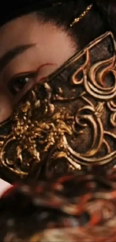 Close-up of a intricate golden mask on a mobile wallpaper.