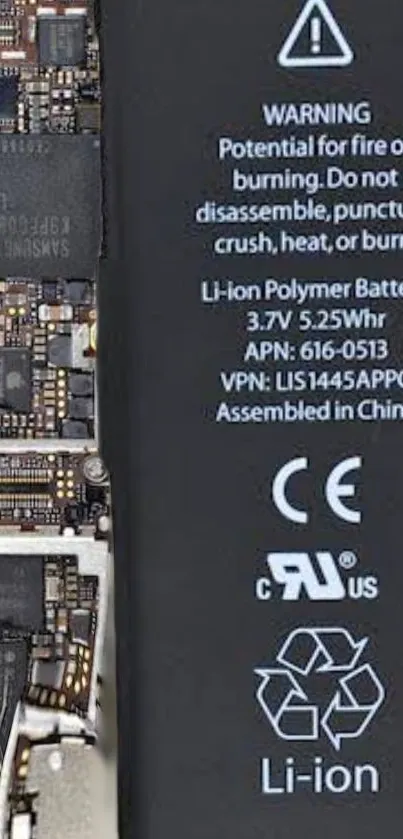 Detailed view of mobile phone's internal circuitry and battery warning.