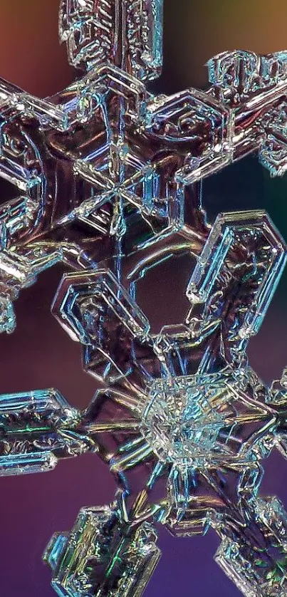 Close-up of an intricate snowflake crystal on a colorful blurred background.