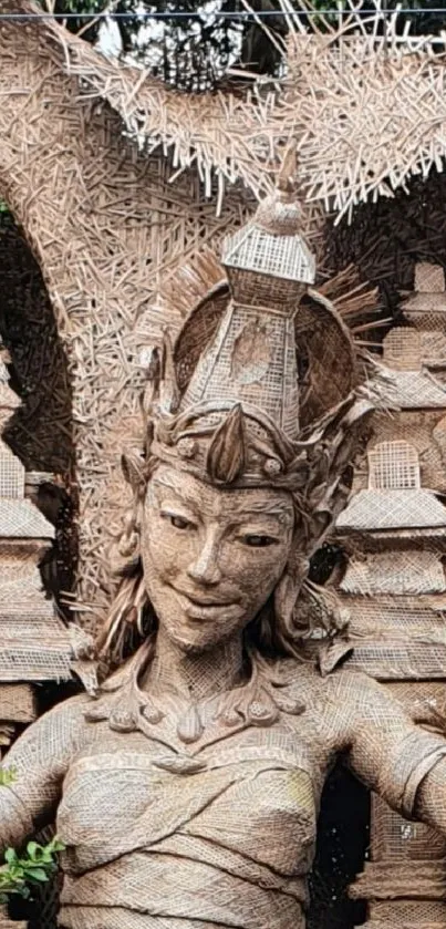 Intricate wood carving of a traditional sculpture on mobile wallpaper.