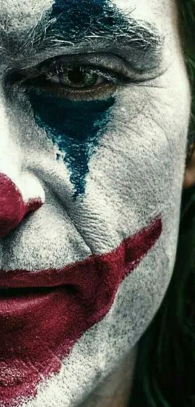 Close-up of a clown face with red and blue makeup.