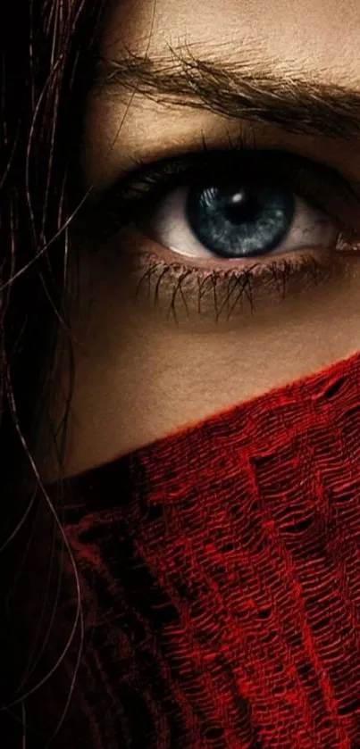 Image of a captivating eye covered with a red cloth.