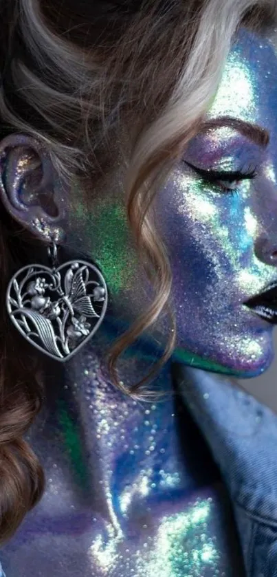 Iridescent face with glittery makeup and large heart earring.