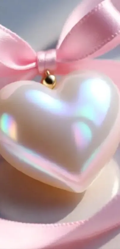 Iridescent heart ornament with pink ribbon.