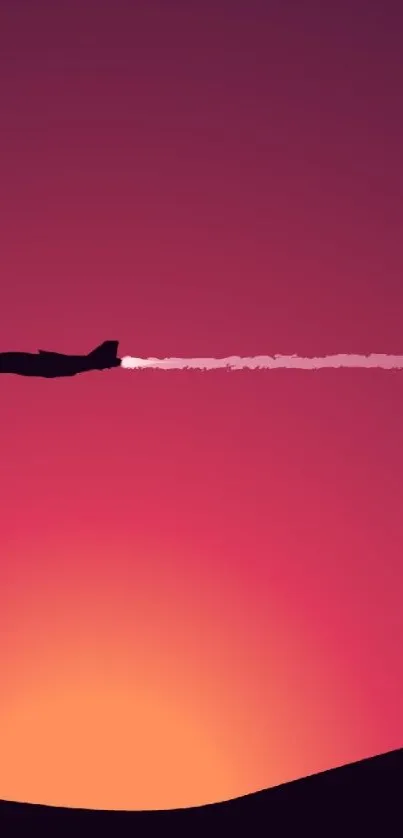 Silhouette of a jet against a vibrant red-orange sunset sky.