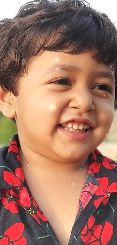 Smiling child in a green park setting.