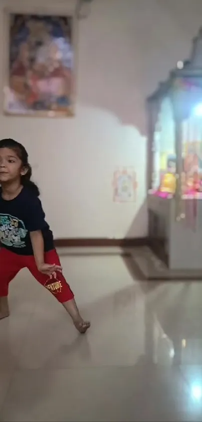 A child joyfully playing indoors with a colorful background.