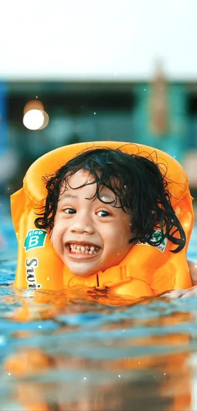 Smiling child in an orange life vest swimming in a pool on a sunny day.