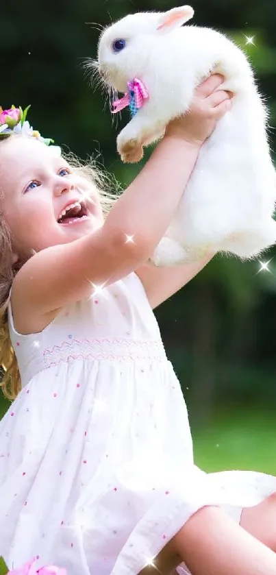 Joyful child in white dress lifts a fluffy bunny with a flower crown.