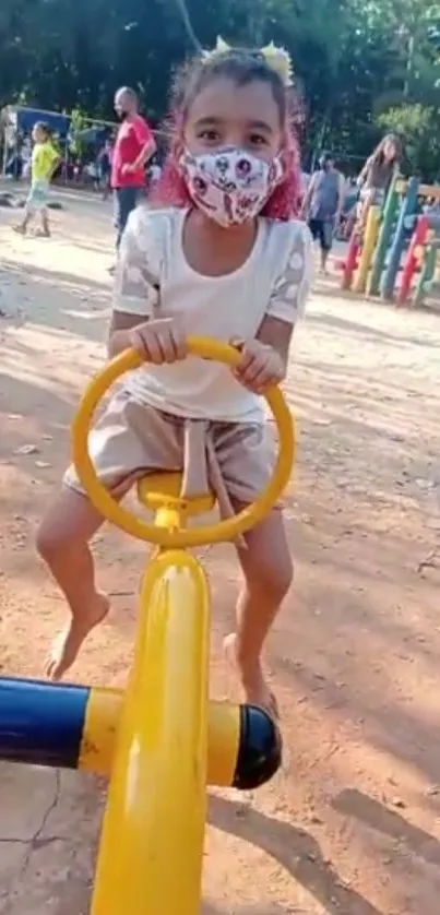 Child enjoying a day at the playground on a seesaw.