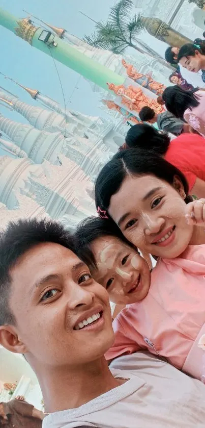 Family smiling in front of Myanmar temple, showcasing cultural beauty.