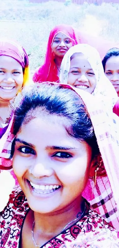 Group of women taking a joyful outdoor selfie.