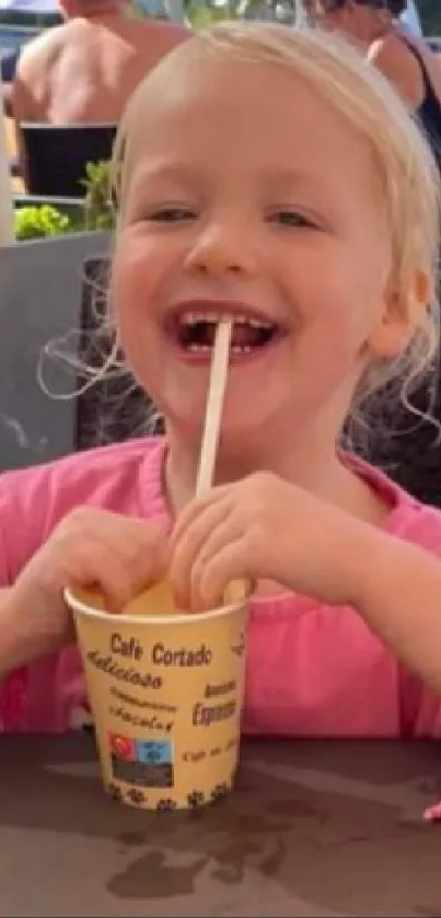 Child enjoying ice cream at an outdoor cafe scene.