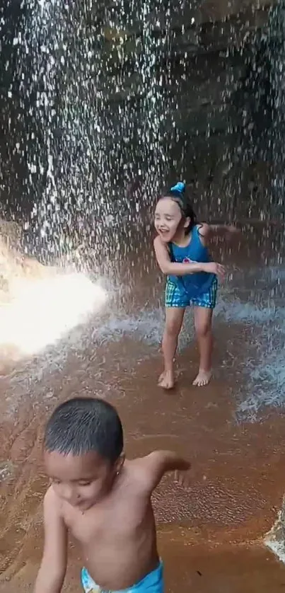 Kids playing under a waterfall, enjoying the water.