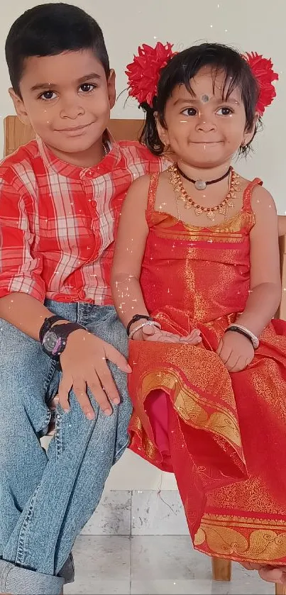 Two joyful kids in bright traditional clothing.